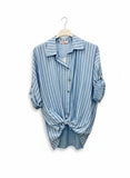 A long-sleeved striped shirt in baby blue color, displayed on a hanger against a white background.