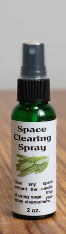 Space clearing spray bottle with black cap and label on a white background