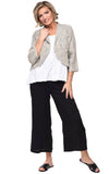 Woman wearing a light beigeblazer, white top, and black pants on a white background