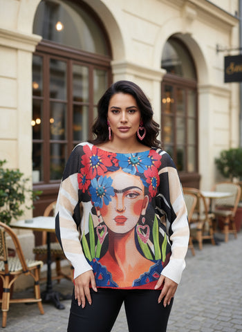 Colorful sweater with a design of a woman with flowers on a hanger against a white background