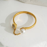 Gold Ring With Rhinestone And Pearl Connected By A Chain
