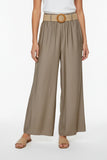 Beige palazzo pants with a belt on a hanger against a white background