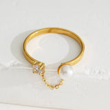 Gold Ring With Rhinestone And Pearl Connected By A Chain