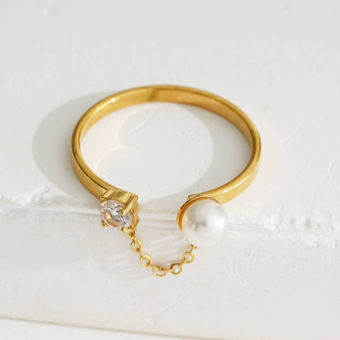 Gold Ring With Rhinestone And Pearl Connected By A Chain
