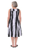 Woman wearing a black and white striped dress on a white background