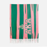 Striped scarf with 'AKA' lettering and logo on a white background