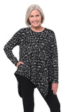 Woman wearing a black tunic with white text pattern on a white background