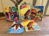 Set of colorful greeting cards featuring artistic illustrations of women on a wooden surface.