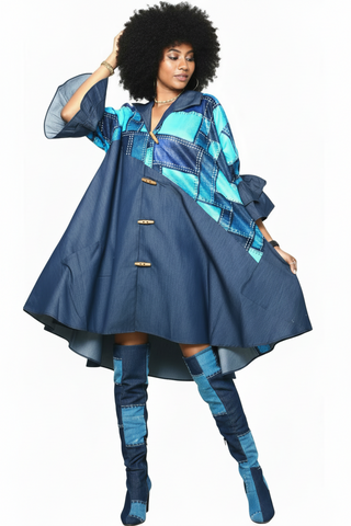 Woman wearing a blue and turquoise swing dress with matching leggings on a white background