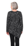Person wearing a black sweater with white text pattern on a white background