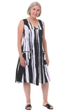 Woman wearing a black and white striped dress on a white background