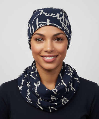 Wearing a navy blue beanie with a matching scarf on a white background