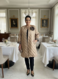 Gold quiltedcoat with leopard corsage design
