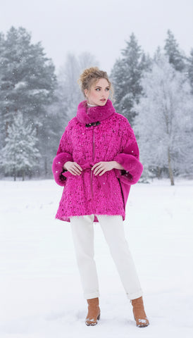 Woman wearing a bright pink sequined jacket on a white background
