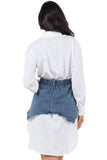 Person wearing a white shirt with a denim skirt on a white background