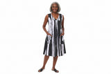 Woman wearing a black and white striped dress on a white background